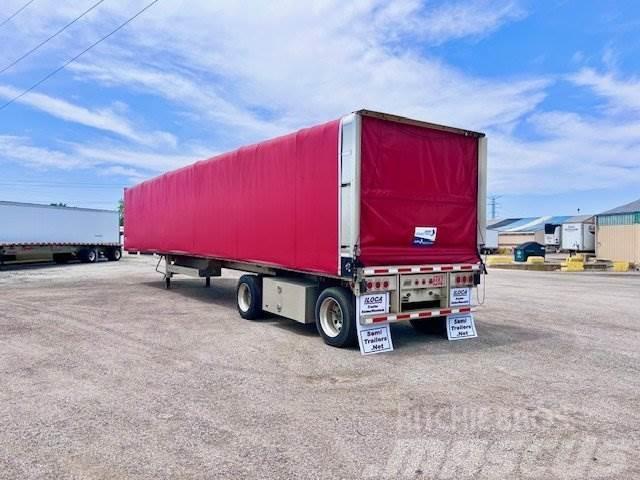 East Mfg FLATBED WITH ROLLING TARP Curtainsider trailers