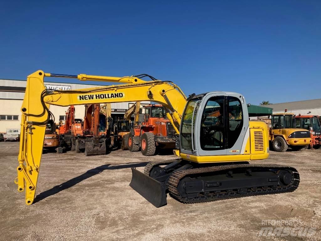 New Holland E 135 SR Midigraafmachines 7t - 12t