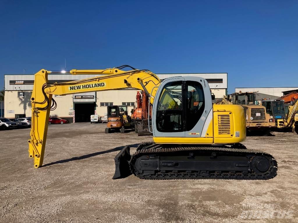 New Holland E 135 SR Midigraafmachines 7t - 12t