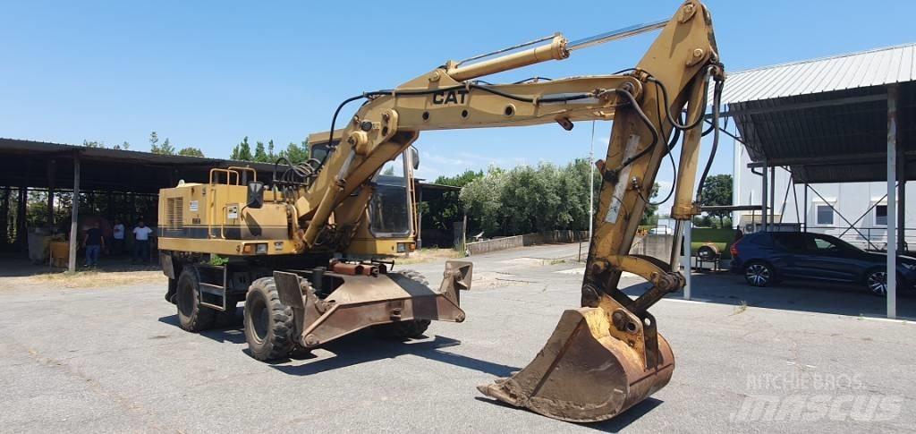 CAT 214 B Wielgraafmachines
