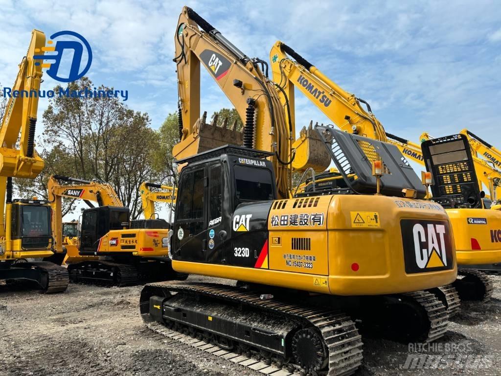 CAT 323 Rupsgraafmachines