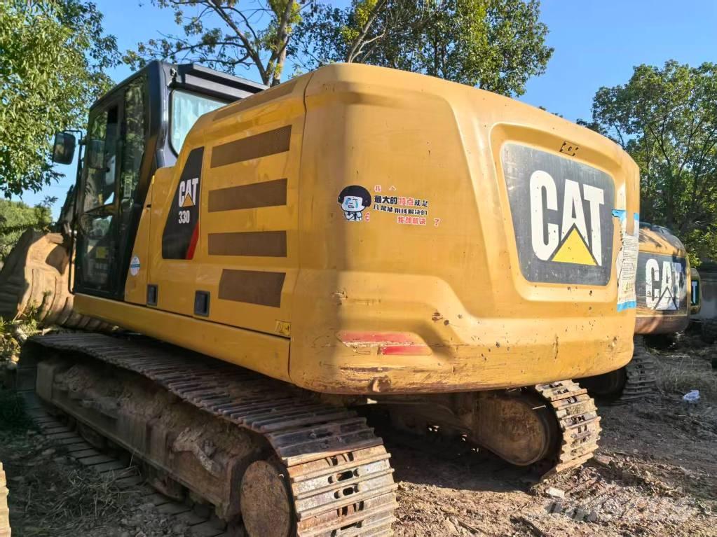 CAT 323 Rupsgraafmachines