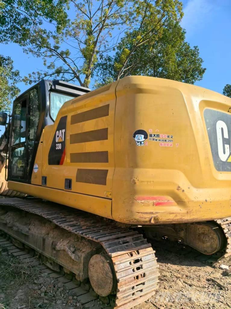 CAT 323 Rupsgraafmachines