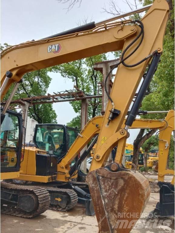 CAT 310 Rupsgraafmachines