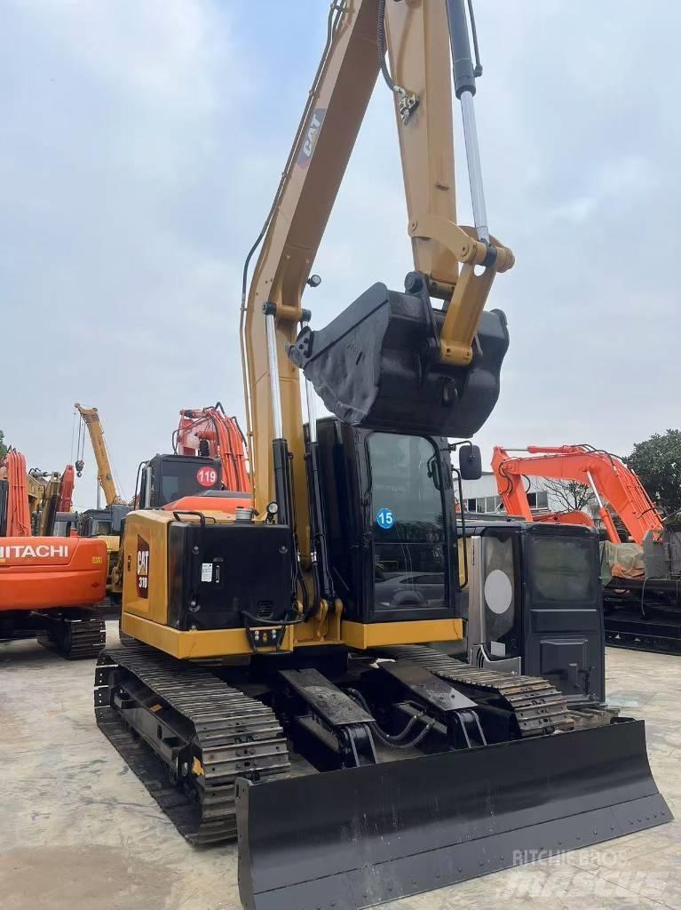 CAT 310 Rupsgraafmachines