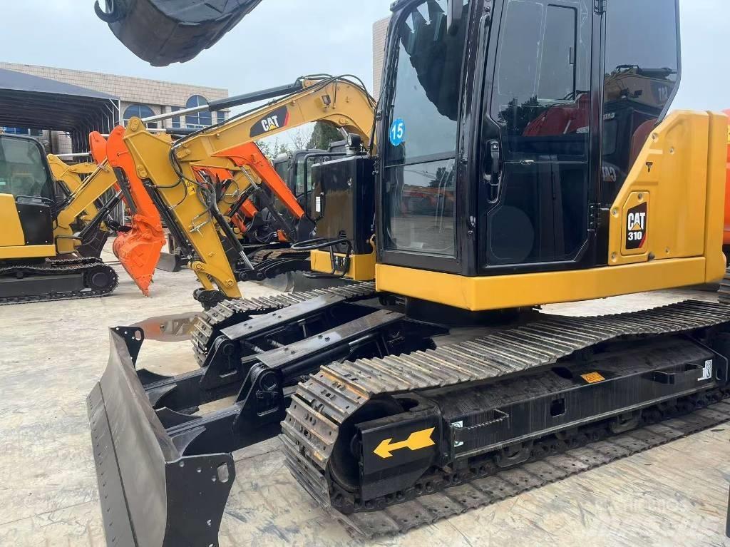 CAT 310 Rupsgraafmachines