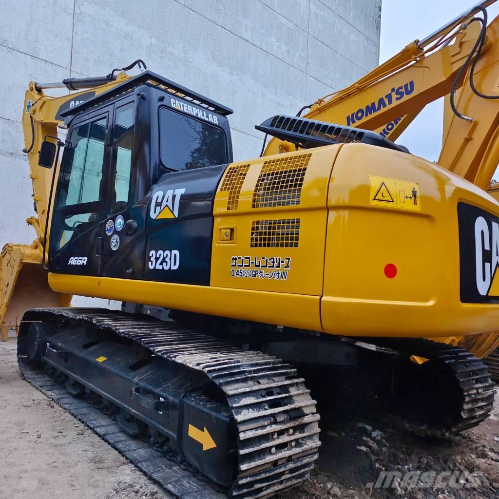 CAT 323 Rupsgraafmachines
