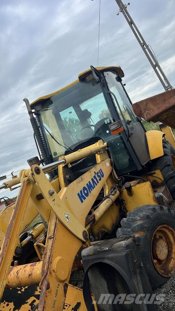 Komatsu WB 93 R Rupsbanden, kettingen en onderstel