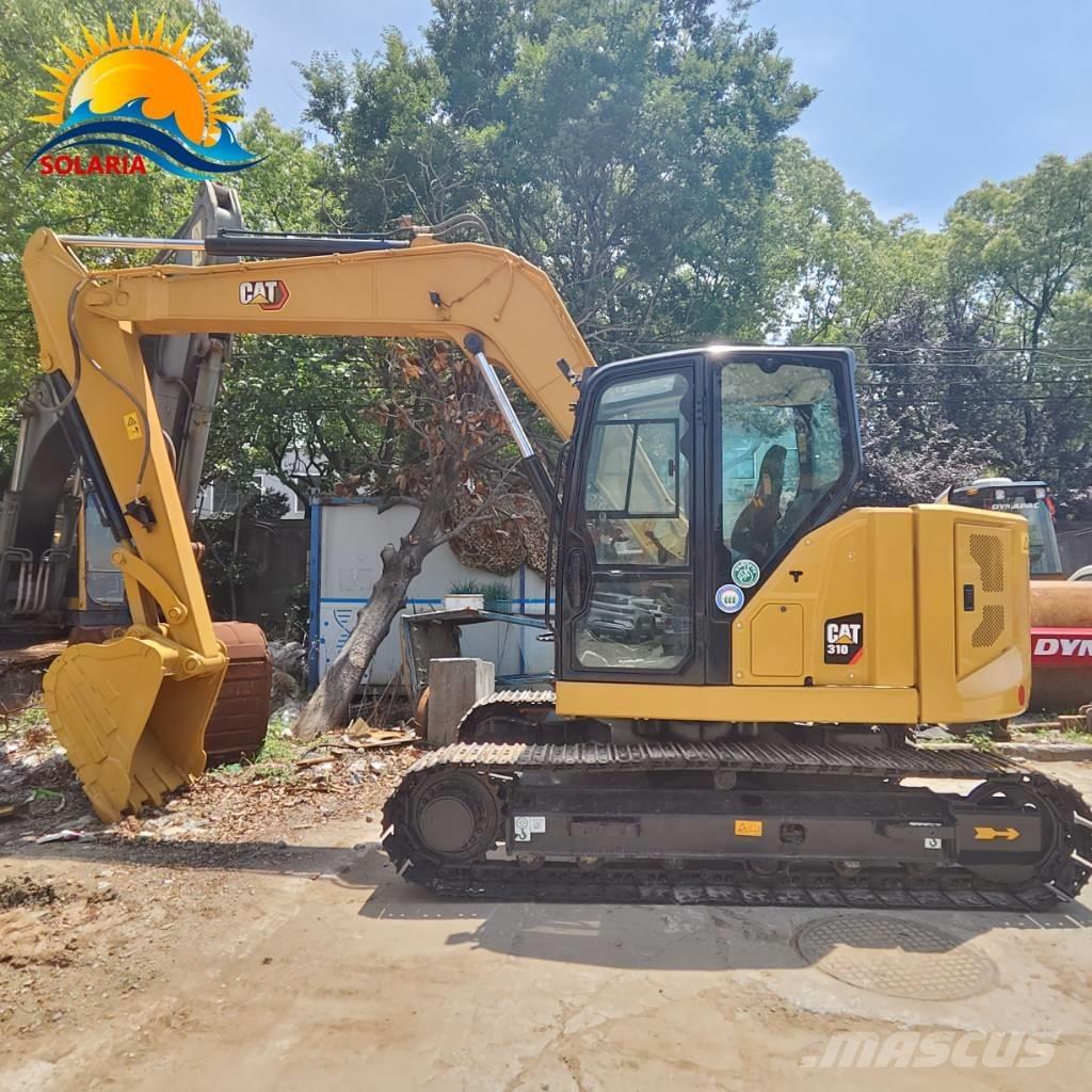 CAT 310 Rupsgraafmachines