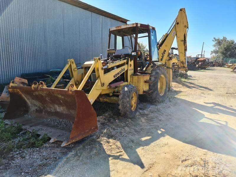 Komatsu WB97R Graaf-laadcombinaties