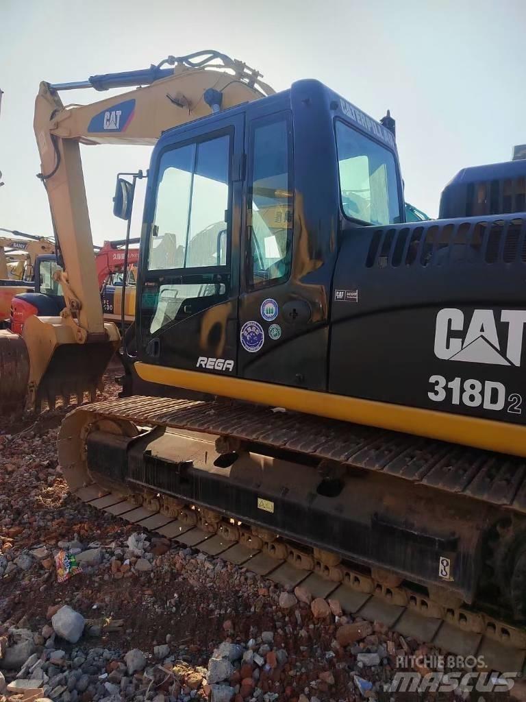 CAT 318 Rupsgraafmachines