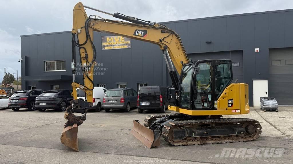 CAT 310 Rupsgraafmachines