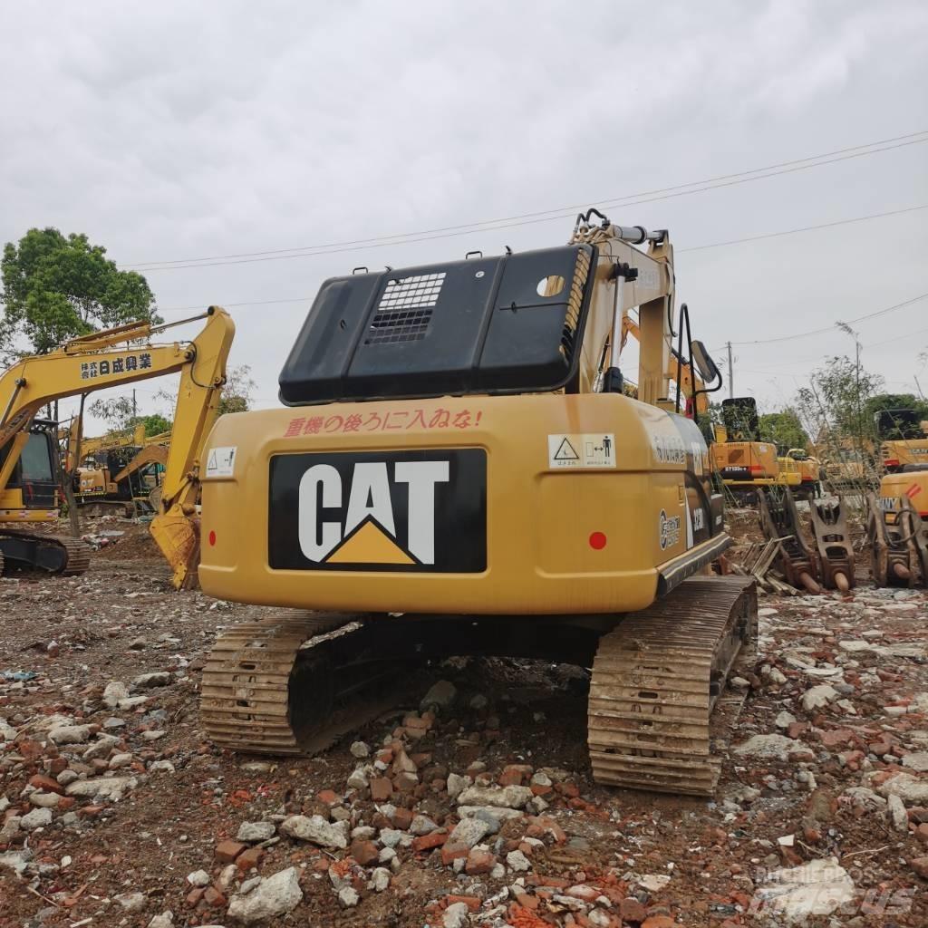 CAT 323DL Rupsgraafmachines