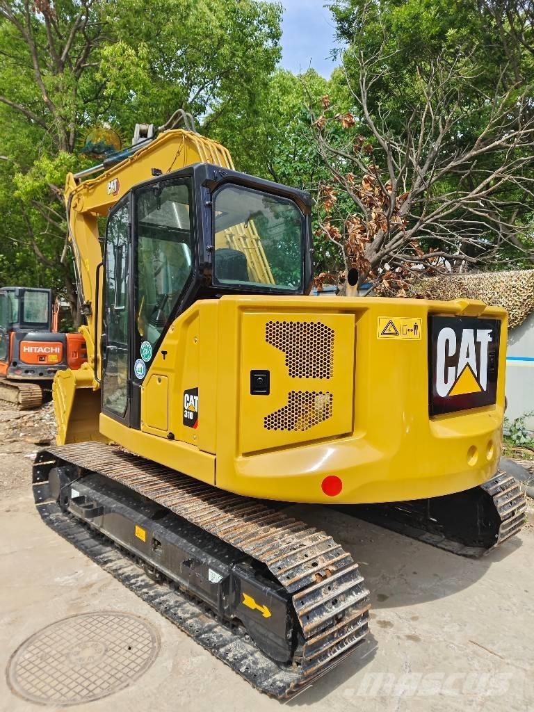 CAT 310 Rupsgraafmachines