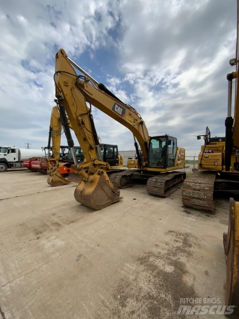 CAT 323 Rupsgraafmachines