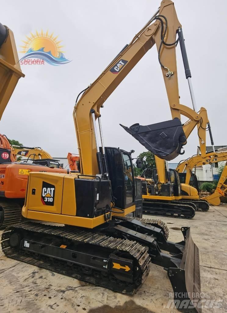 CAT 310 Rupsgraafmachines