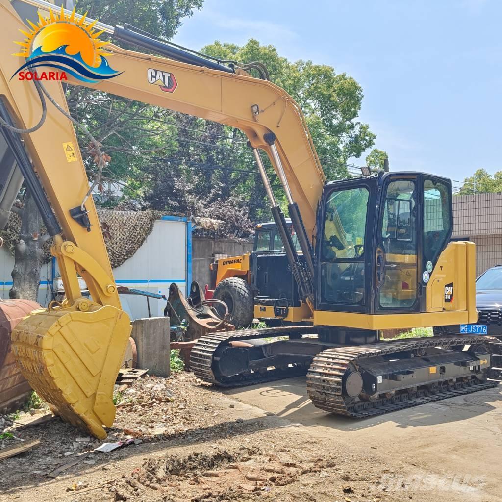 CAT 310 Rupsgraafmachines