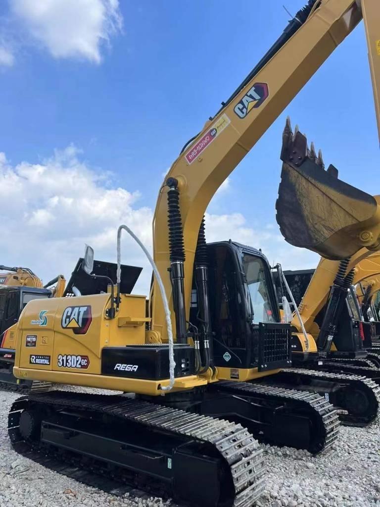 CAT 313 Rupsgraafmachines