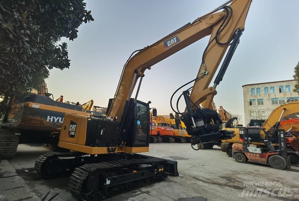 CAT 310 Rupsgraafmachines