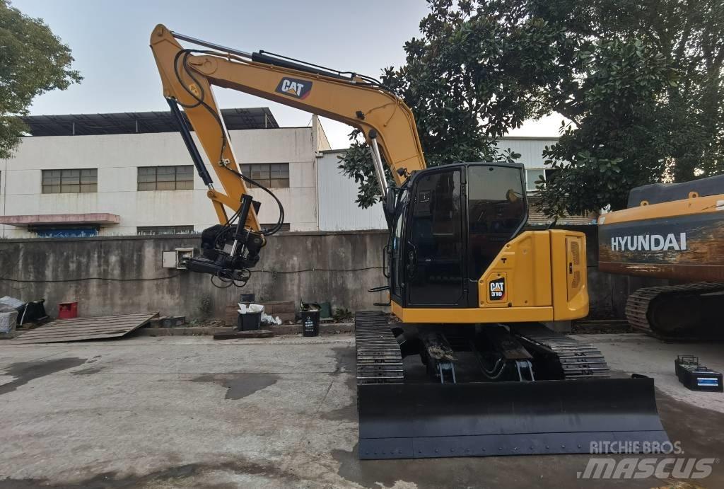 CAT 310 Rupsgraafmachines