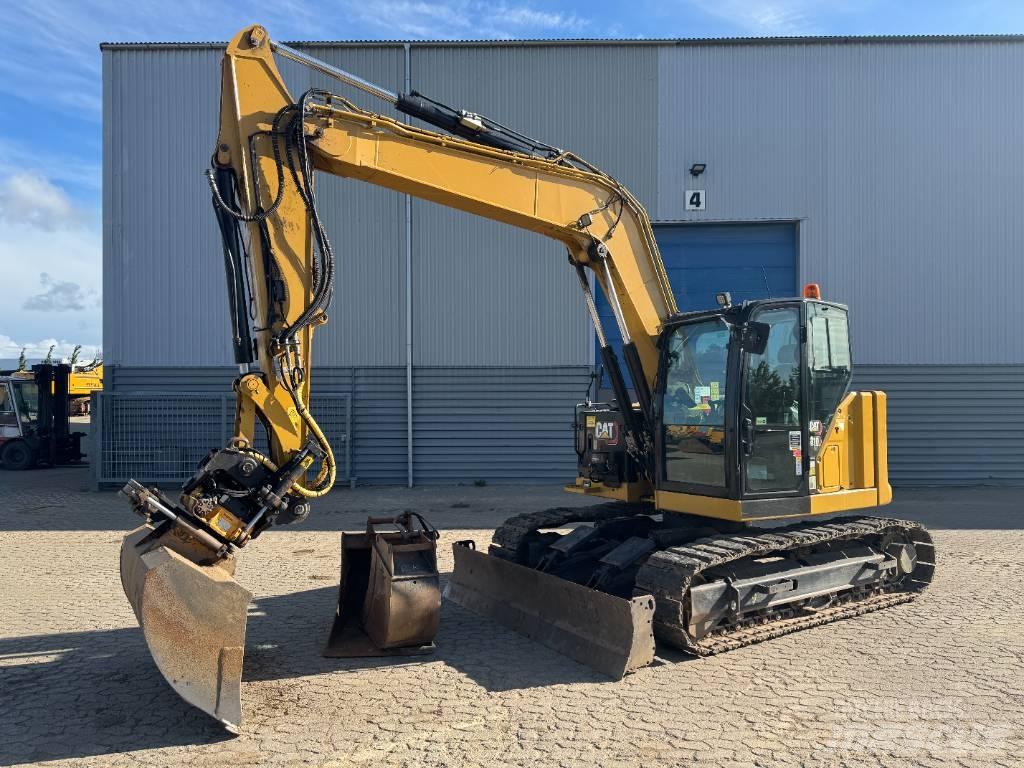 CAT 310 Rupsgraafmachines