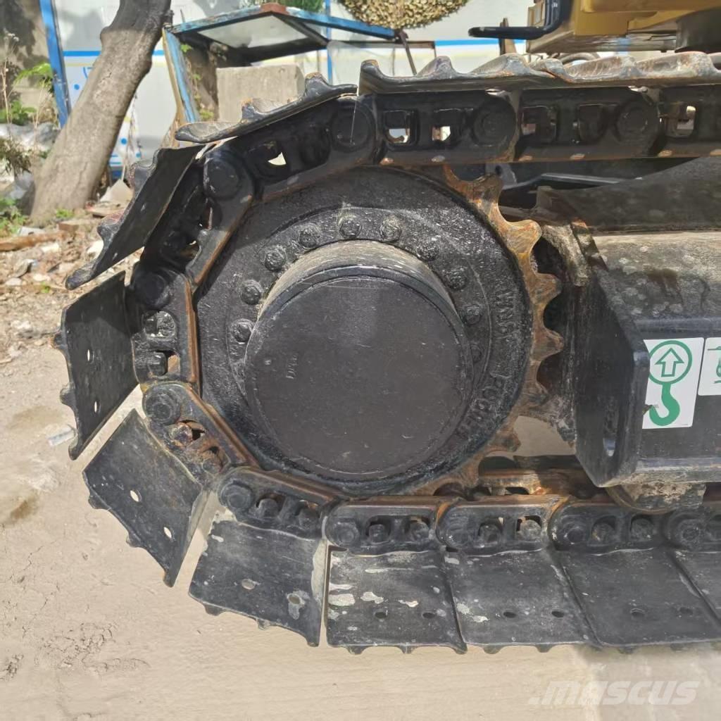 CAT 310 Rupsgraafmachines