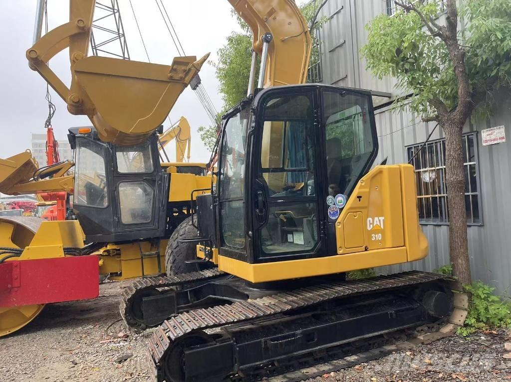 CAT 310 Rupsgraafmachines