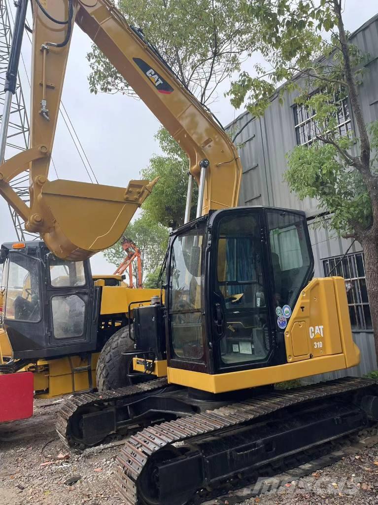 CAT 310 Rupsgraafmachines