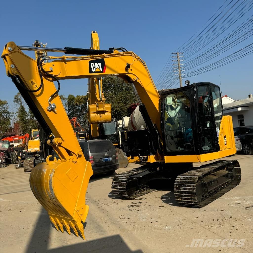 CAT 310 Rupsgraafmachines