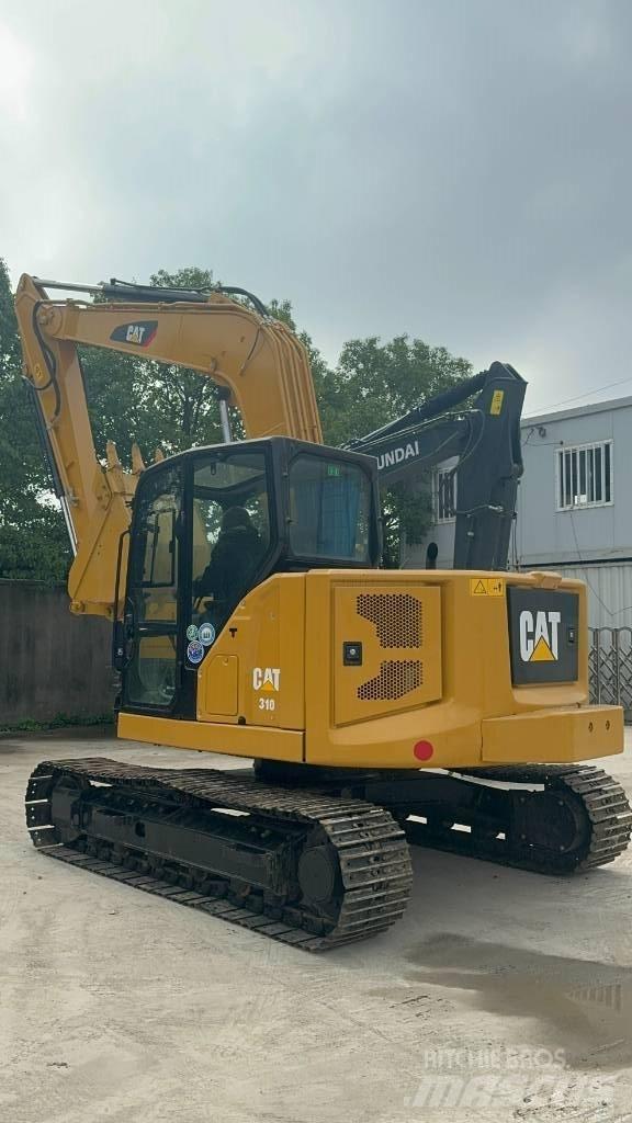 CAT 310 Trilrolwalsen