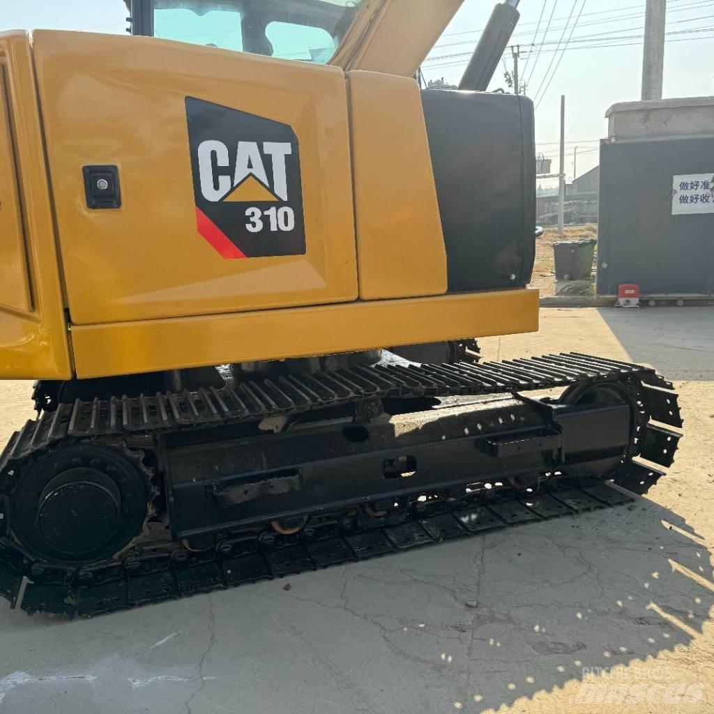 CAT 310 Rupsgraafmachines