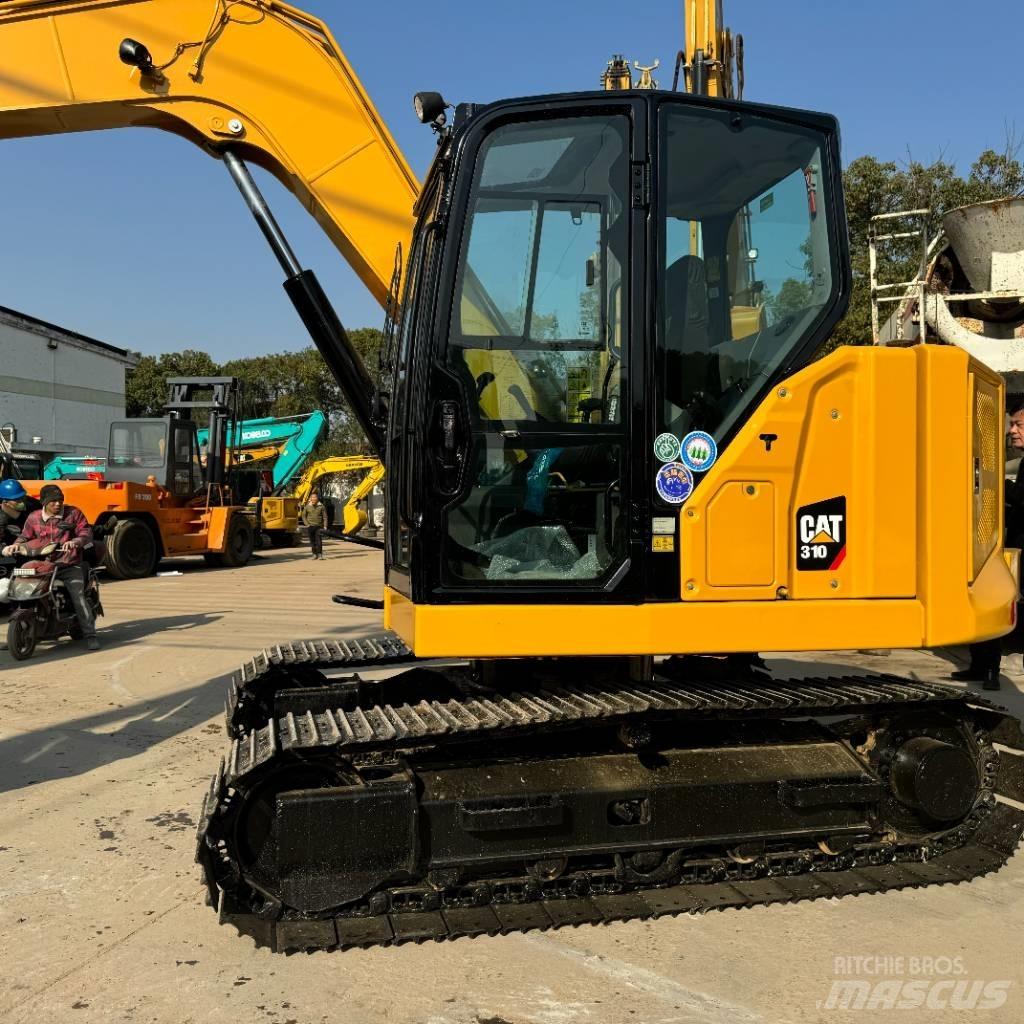 CAT 310 Rupsgraafmachines
