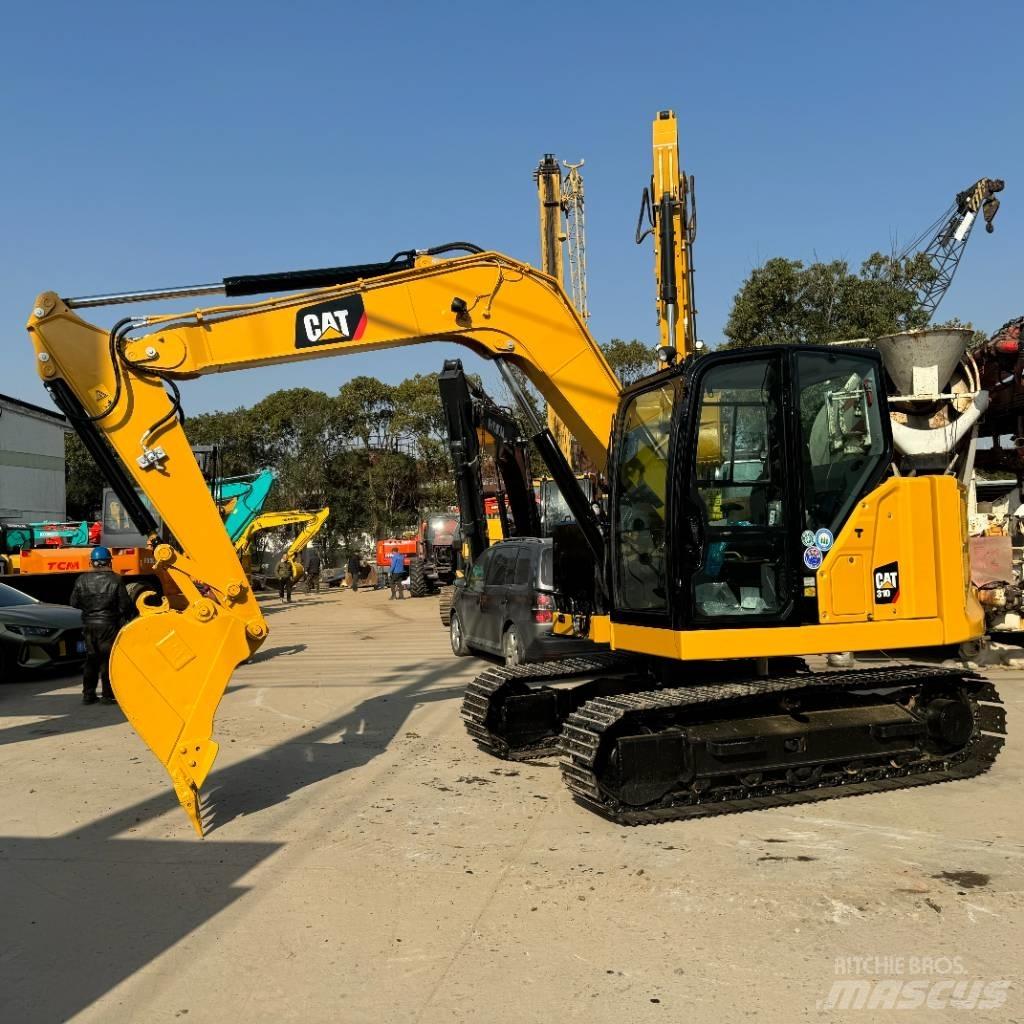 CAT 310 Rupsgraafmachines