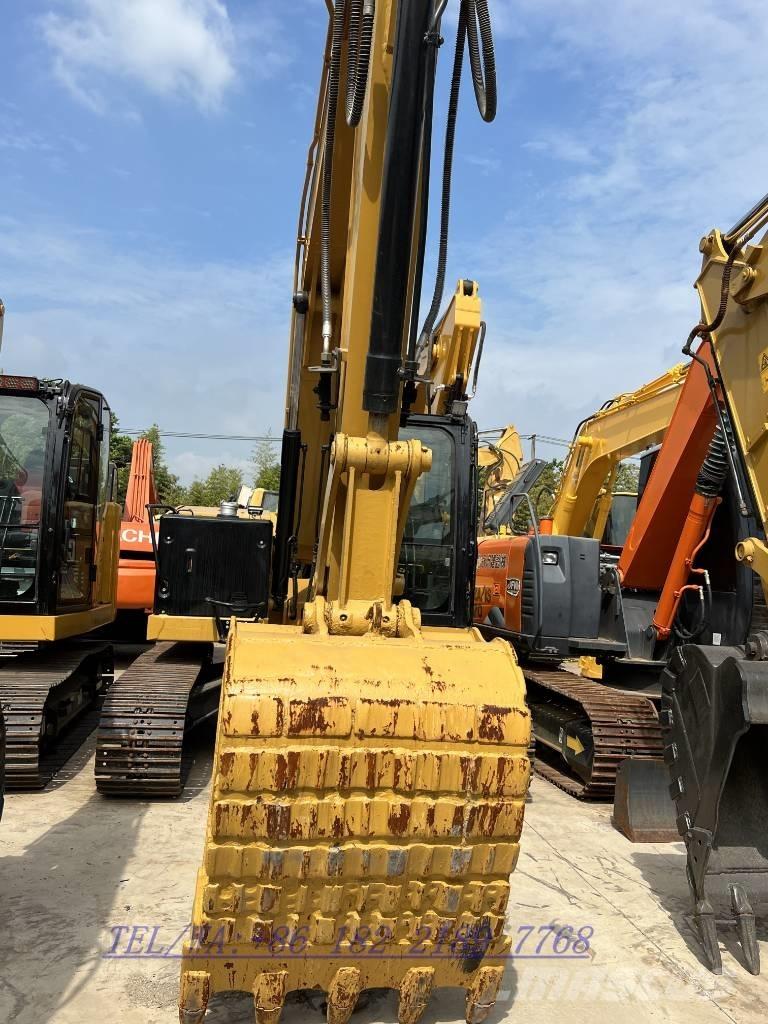CAT 310 Rupsgraafmachines