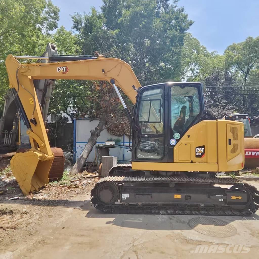 CAT 310 Rupsgraafmachines