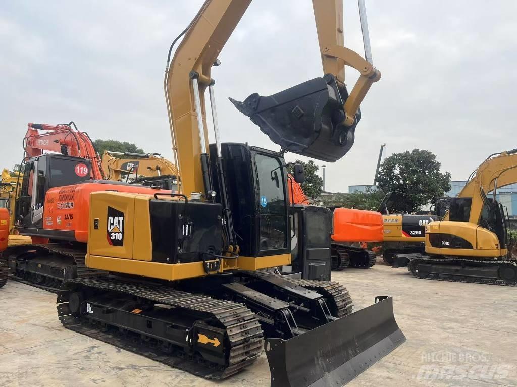 CAT 310 Rupsgraafmachines