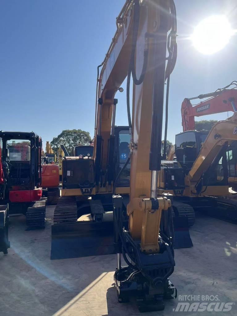 CAT 310 Rupsgraafmachines