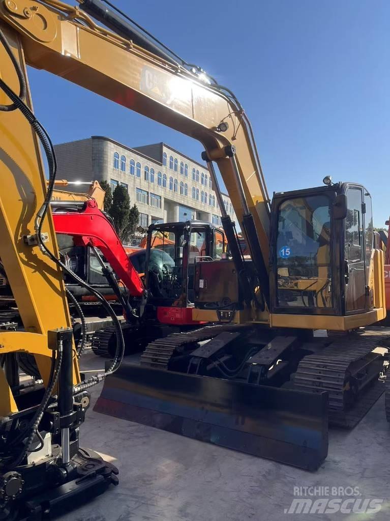 CAT 310 Rupsgraafmachines