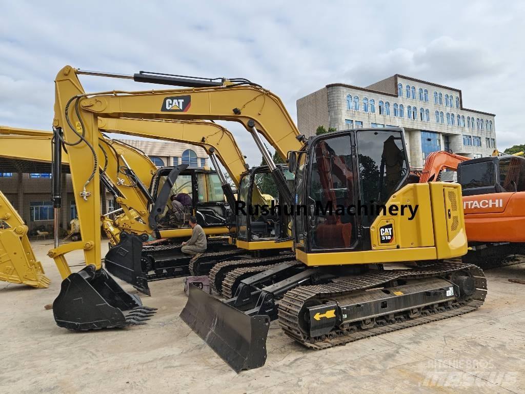 CAT 310 Rupsgraafmachines