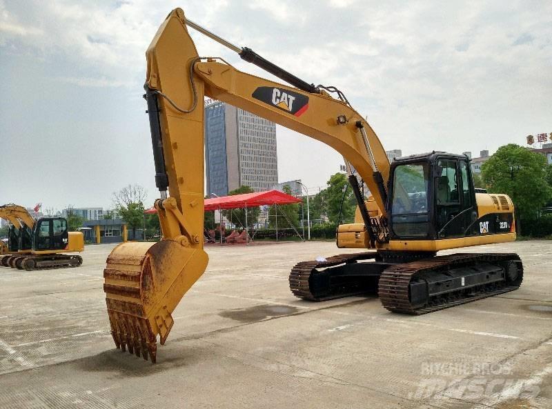 CAT 323 Rupsgraafmachines