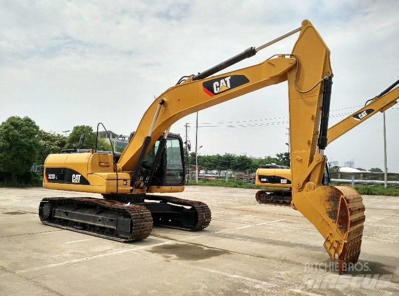 CAT 323 Rupsgraafmachines