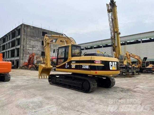 CAT 320 BL Rupsgraafmachines