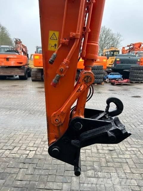 Hitachi ZX140W-5B Wielgraafmachines