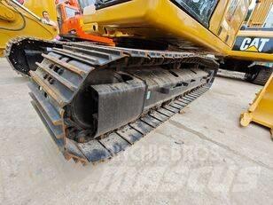 CAT 323 Rupsgraafmachines