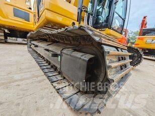 CAT 323 Rupsgraafmachines