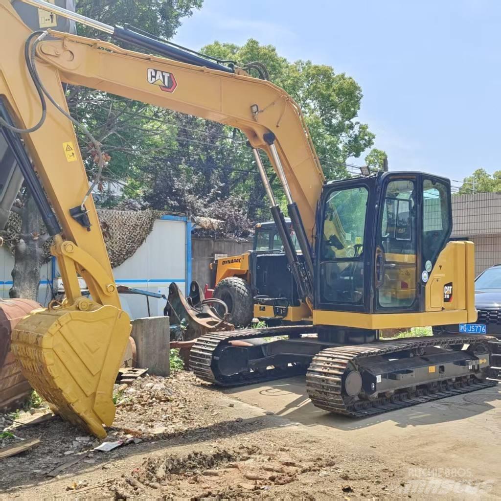 CAT 310 Rupsgraafmachines