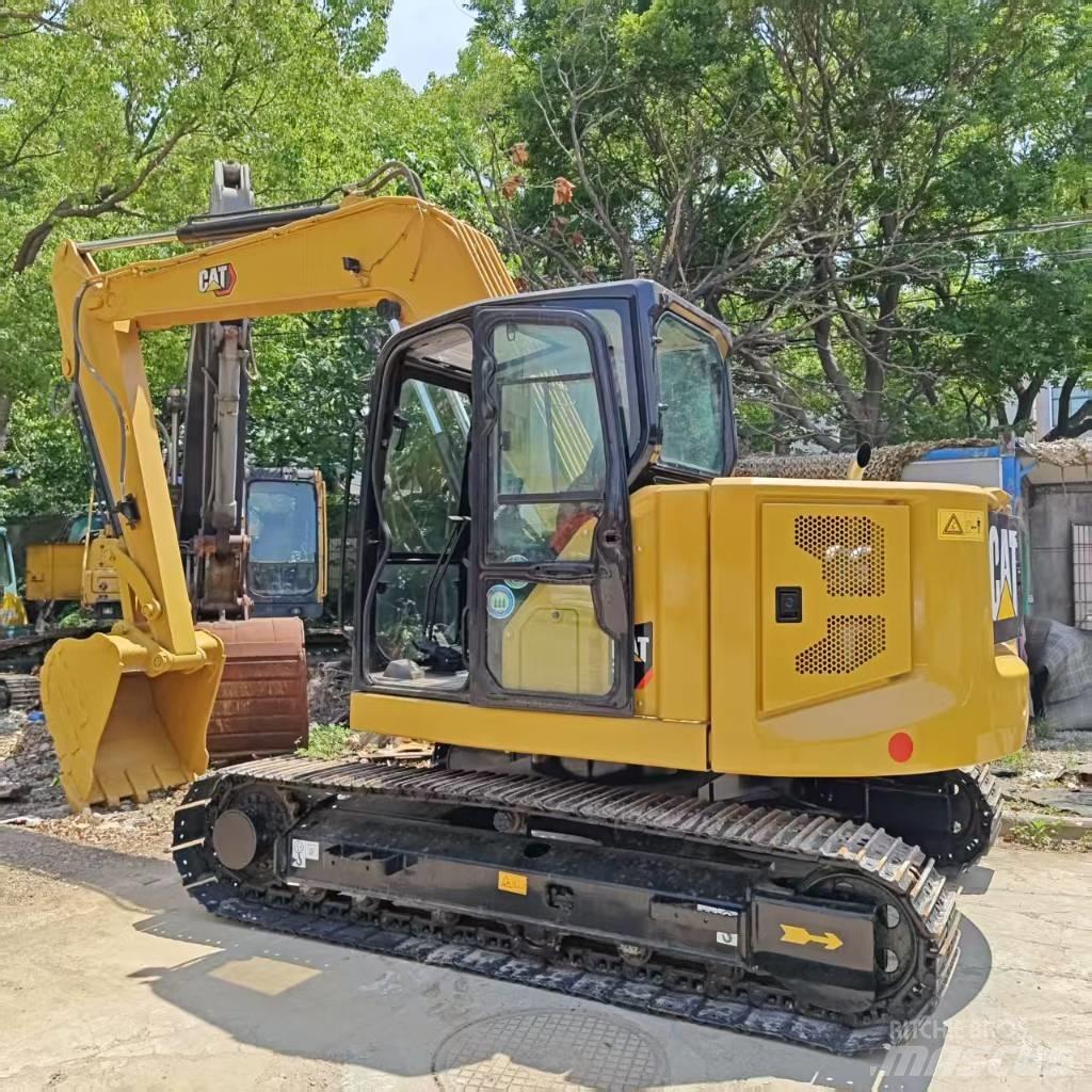 CAT 310 Rupsgraafmachines