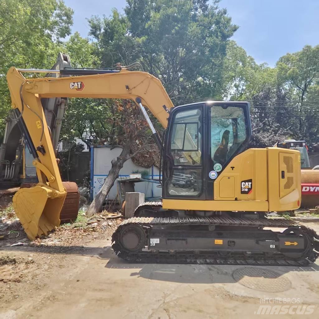 CAT 310 Rupsgraafmachines