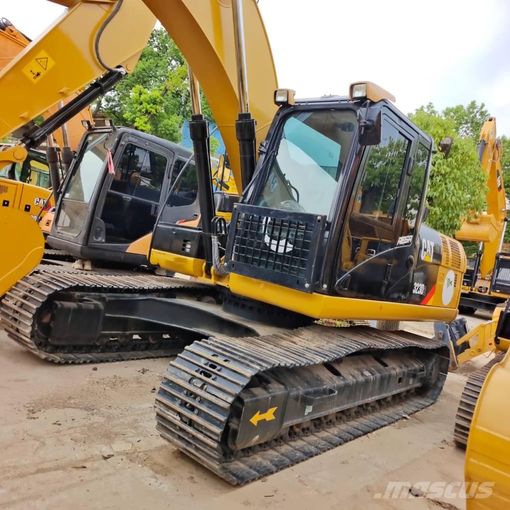 CAT 323 D Rupsgraafmachines