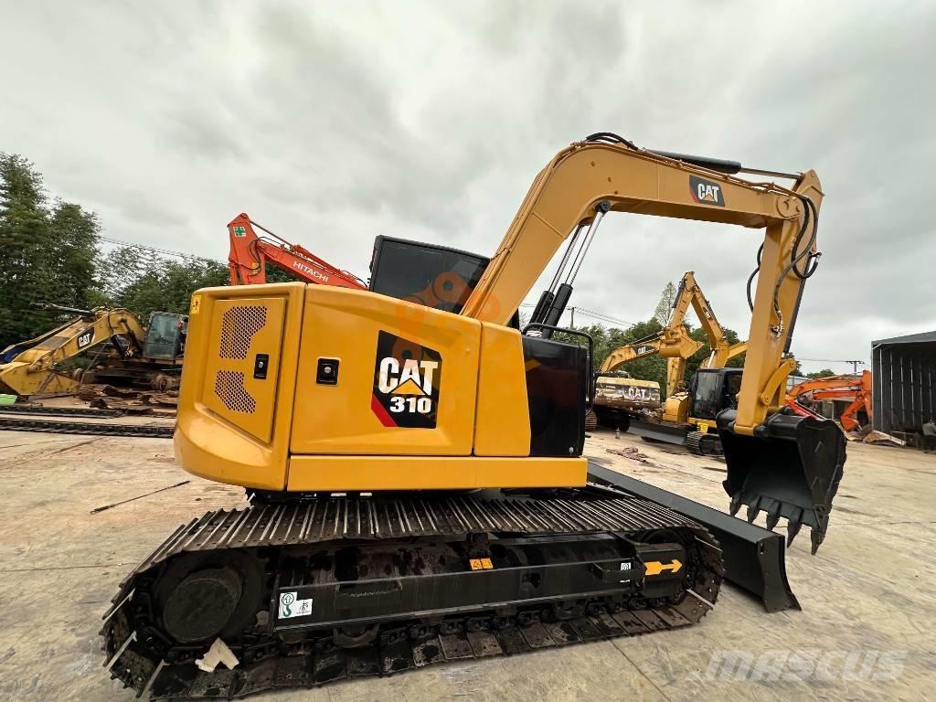 CAT 310 Rupsgraafmachines